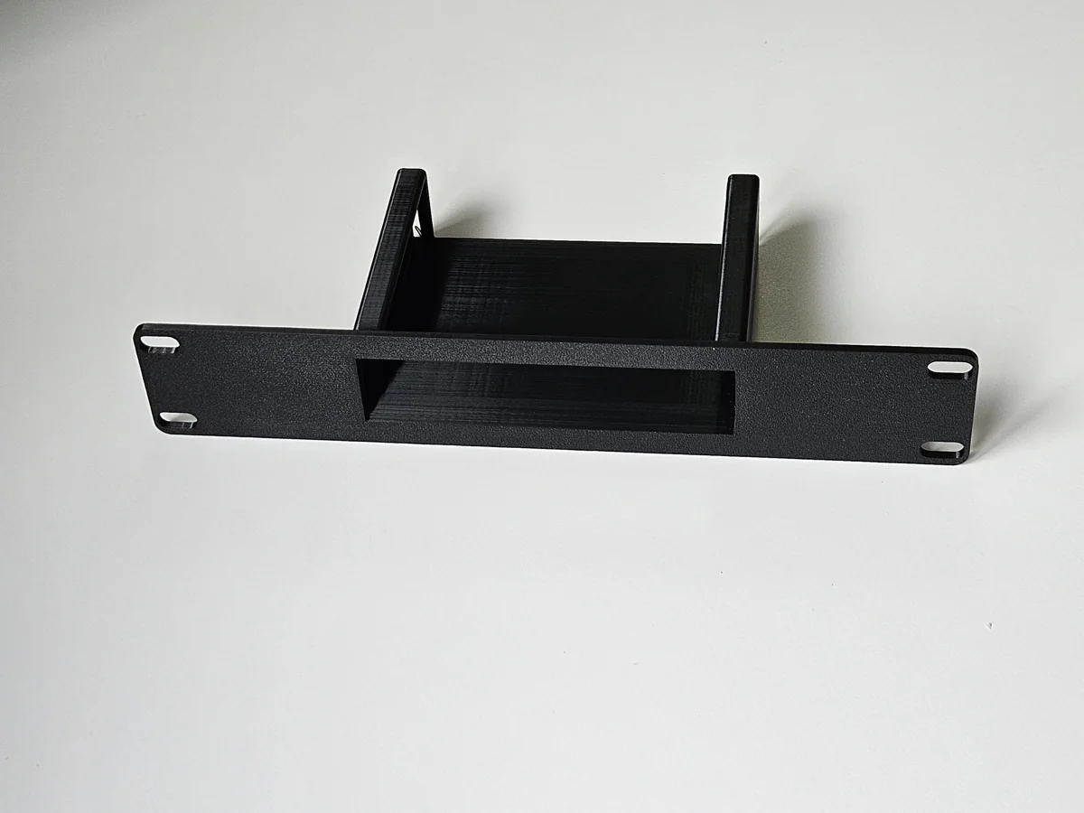 Custom rack-mount adapter for network equipment.